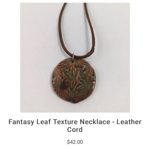 Ravenous Design one of a kind hand built ceramic textured necklace/leather cord.